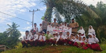 Polsek LTD Tanamkan Cinta Lingkungan Sejak Dini Melalui Program Green Policing di SDN 003 Logas