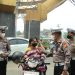 Polres Kuansing Bagikan Masker kepada Pengguna Jalan, Imbau Masyarakat Jaga Kesehatan di Tengah Udara Berasap